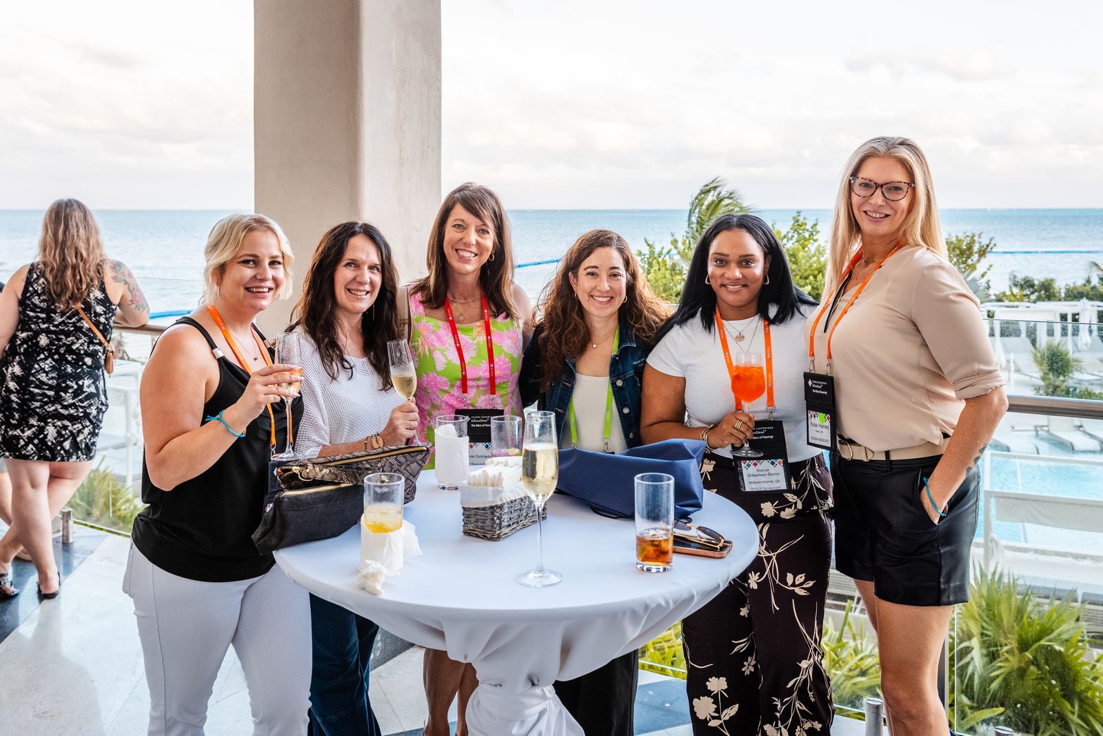 Convention attendees gathered at a reception table